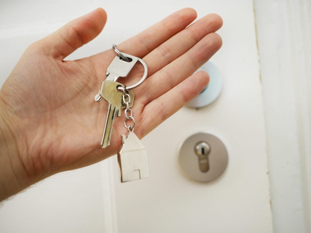 Hand holding a set of house keys
