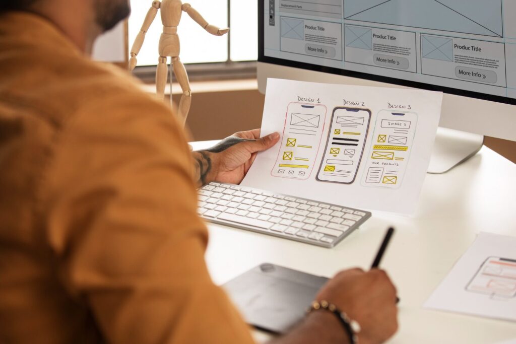Designer working on wireframes to future-proof a mobile app