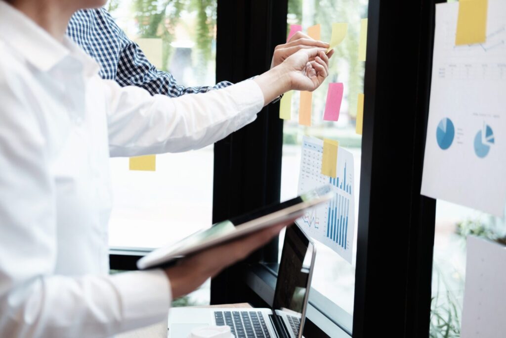 Person presenting charts during a mid-year product health check