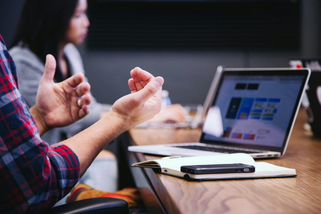 Colleagues in a meeting, closing the gap between strategy and results