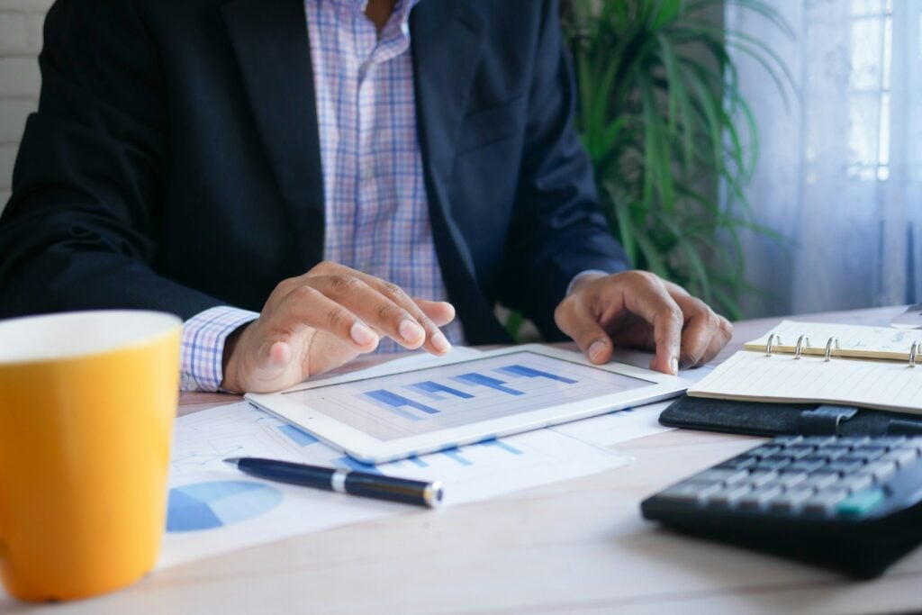 Person reviewing reports to compare activation and retention metrics