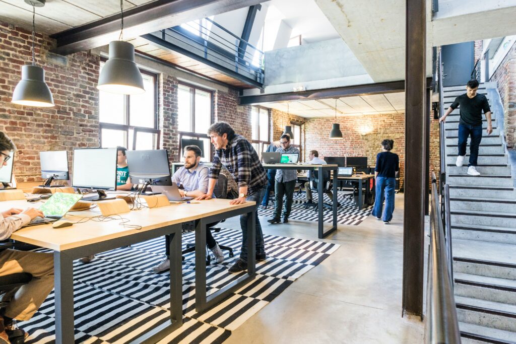Open-plan office of people at desks, where AI will change how efficiency is created
