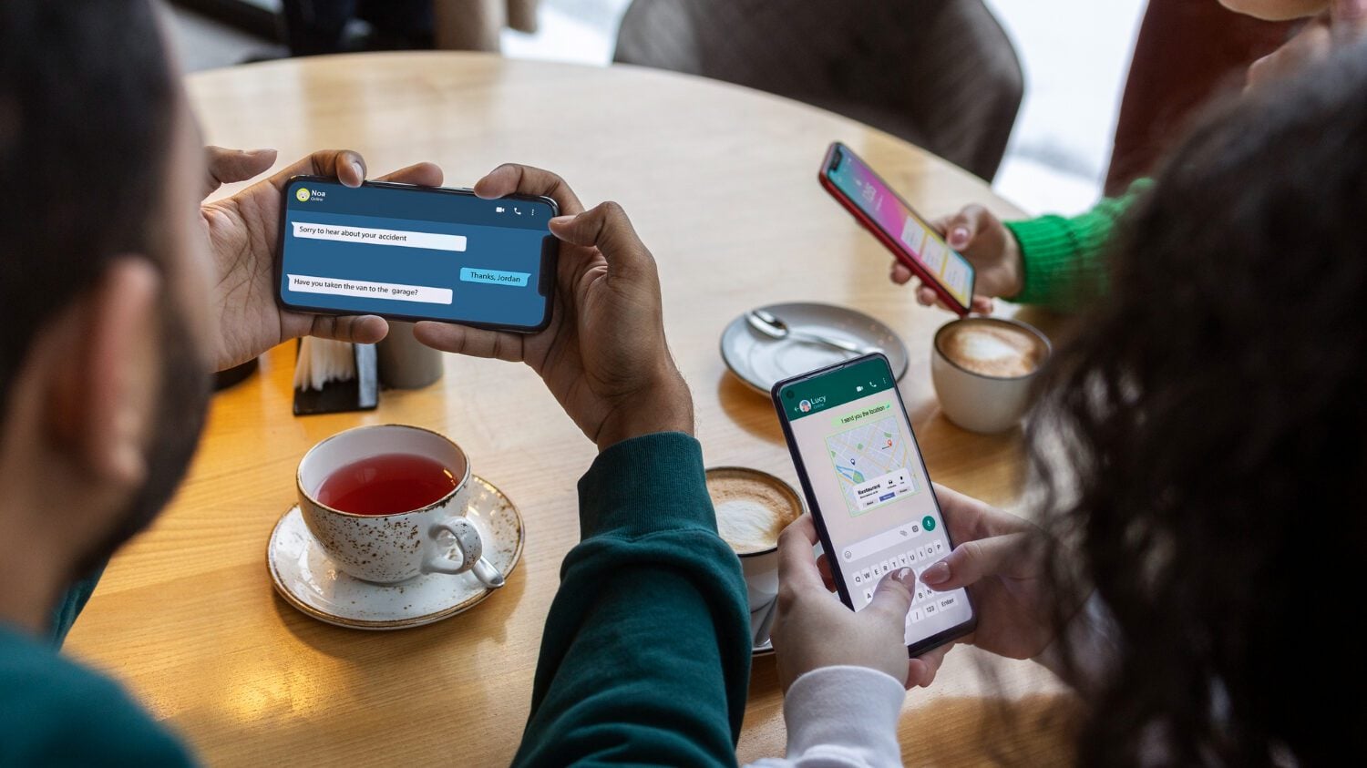 Friends at a café using their phones, the customers loyalty-driven apps keep