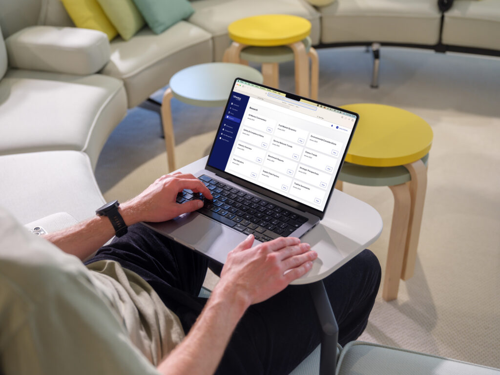 Man reviewing a financial services app on a laptop against FCA Consumer Duty