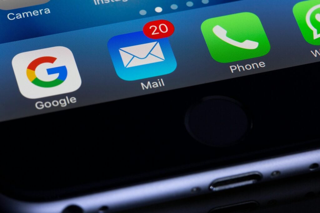 Close-up of phone app icons, as UX design affects user wellbeing