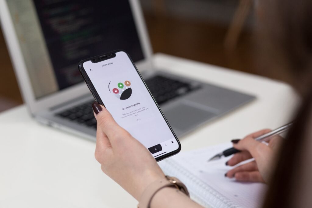 Phone showing an app onboarding screen during quality assurance testing